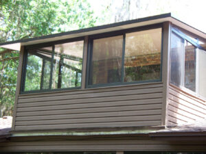 Temple Terrace Sunroom on balcony with vinyl siding exterior