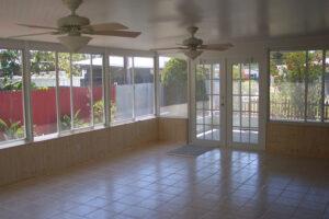 Indian Rocks Beach Acrylic Sunroom with French Doors and tile floors