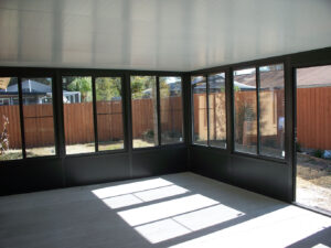 Tampa Sunroom bronze kickplate concrete Tamargo