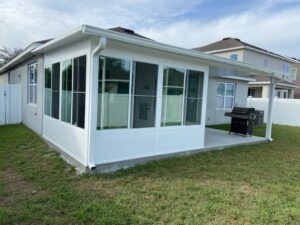 White sunroom with open covered patio