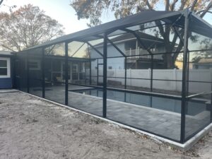 Bronze pool enclosure on wooded lot in Dunedin, FL