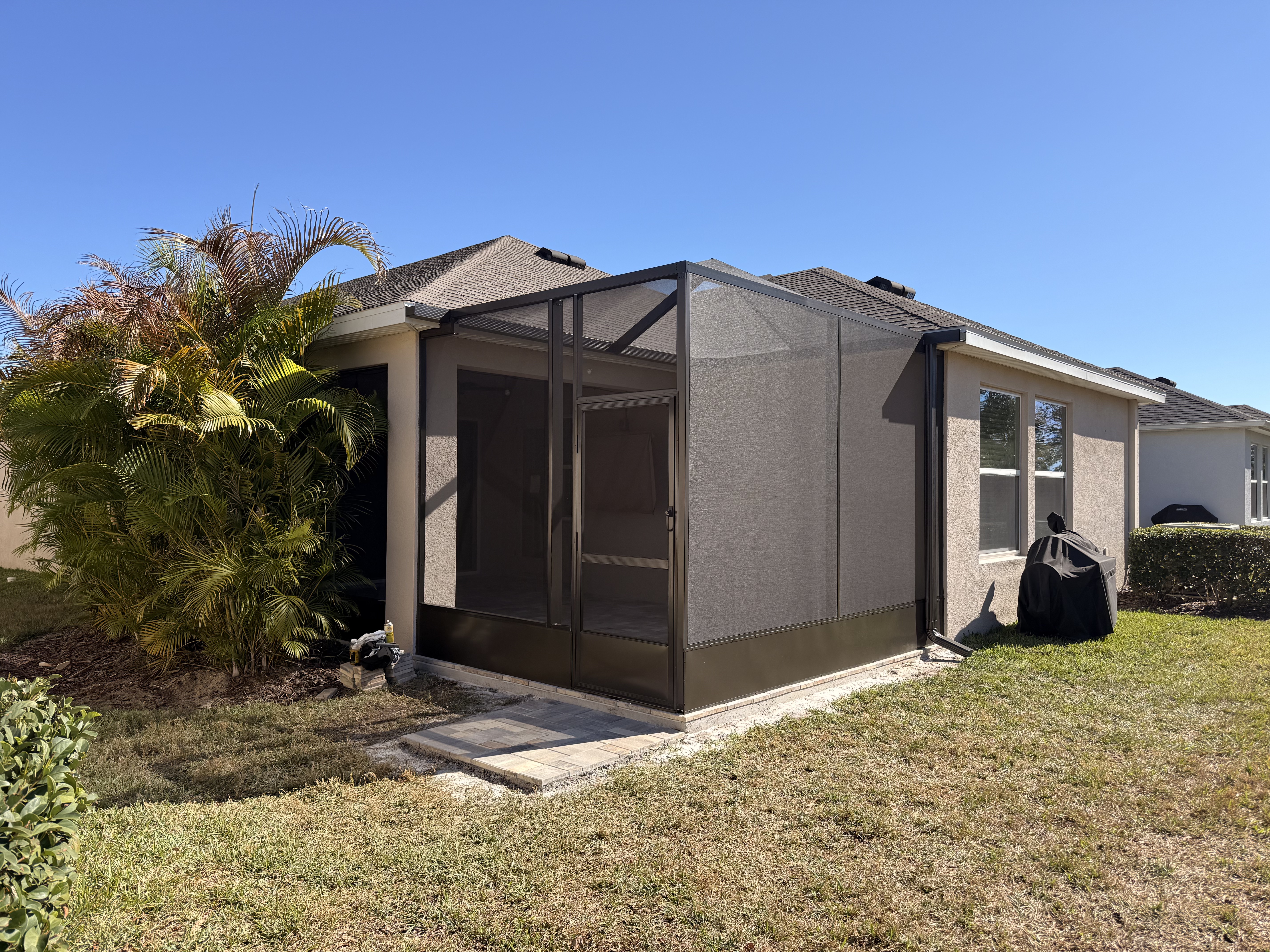 Bronze compact screen enclosure with brick pavers in Lithia, FL near FishHawk