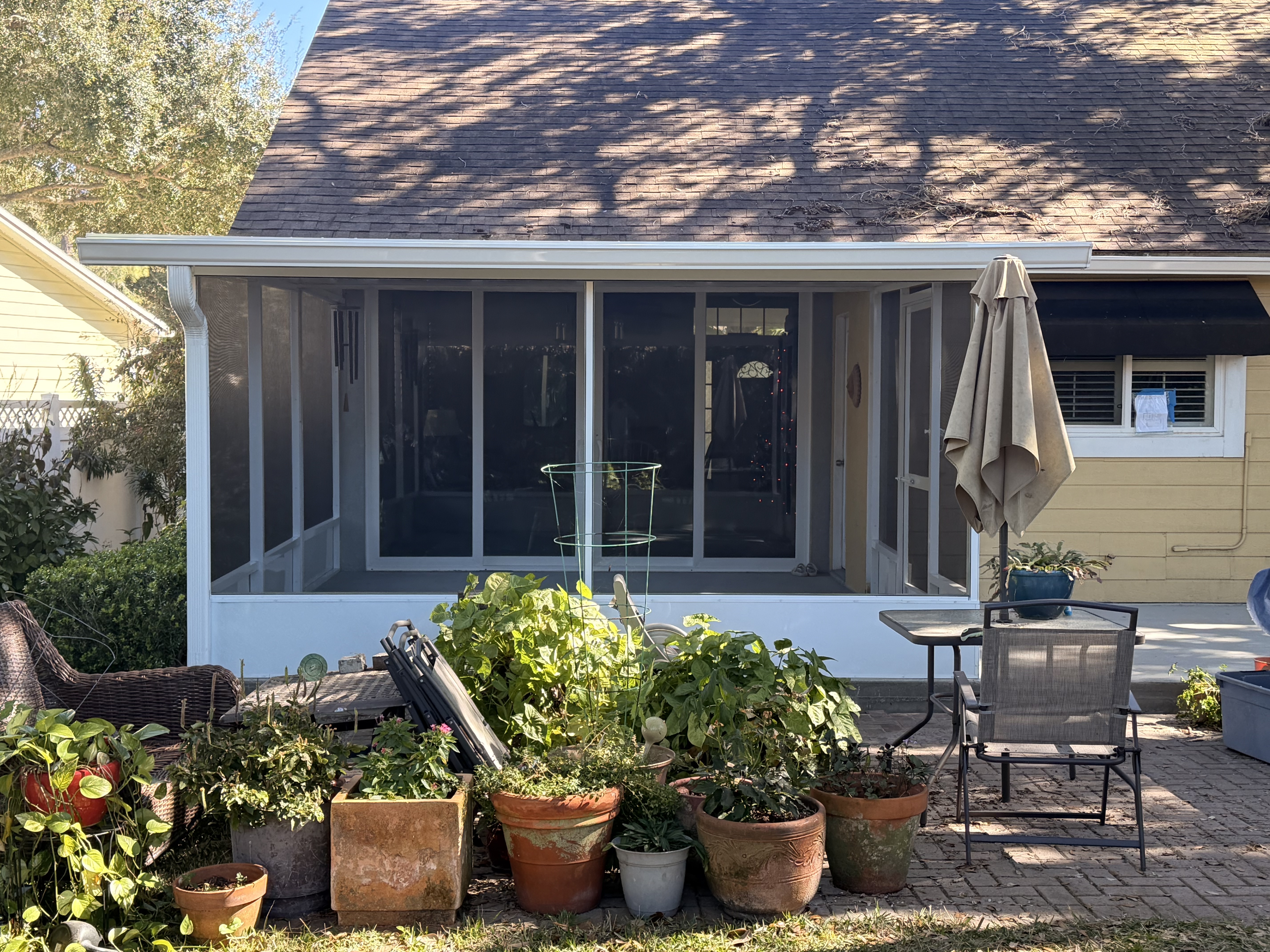 White screen room on wooded lot in Hunter's Green, New Tampa, FL