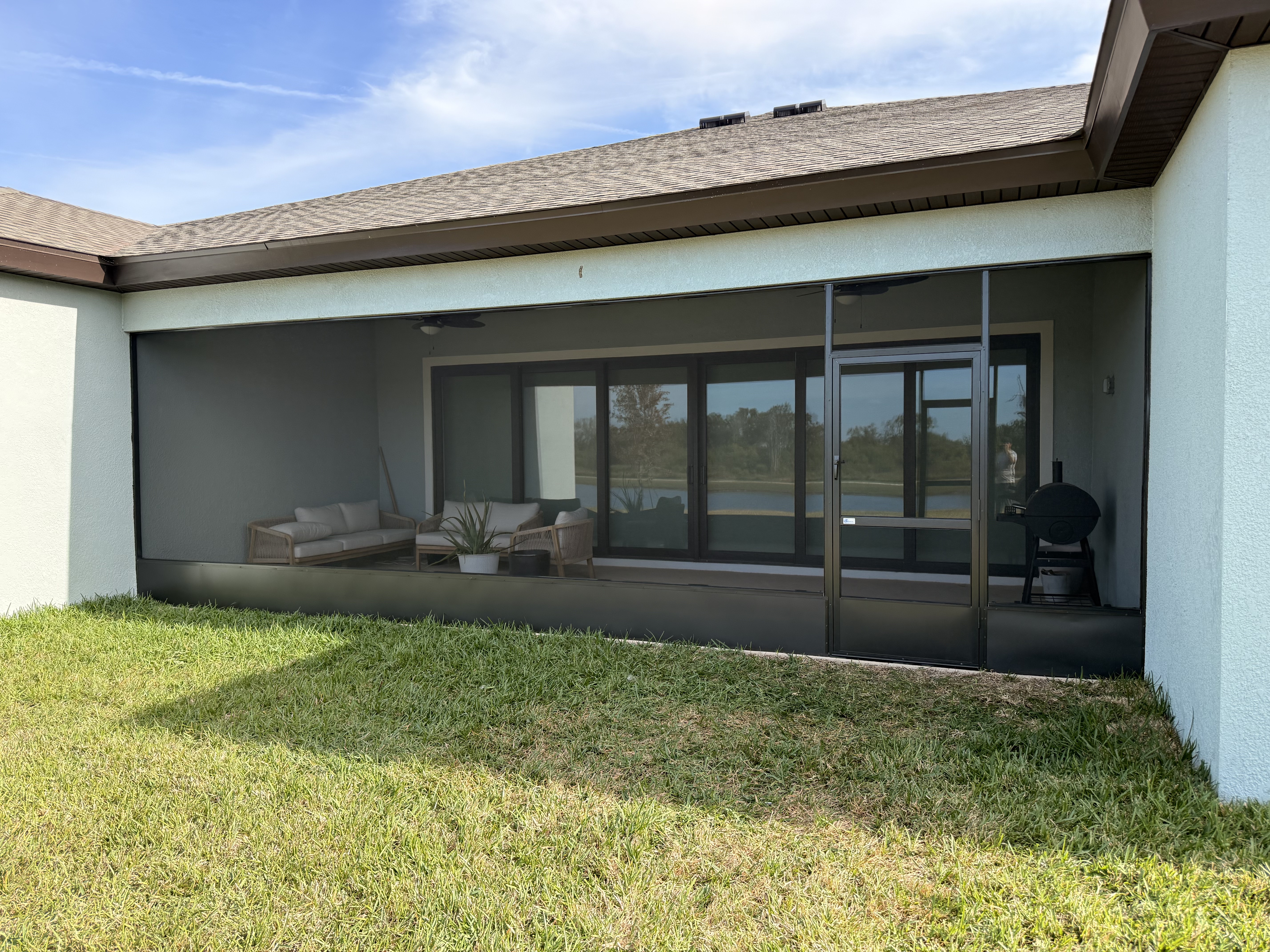 Bronze aluminum screen wall with kick plate in Apollo Beach, FL